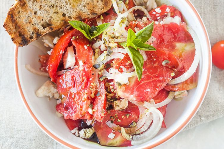Tomato Salad with Feta Cheese, Onion and Pumpkin Seed Oil