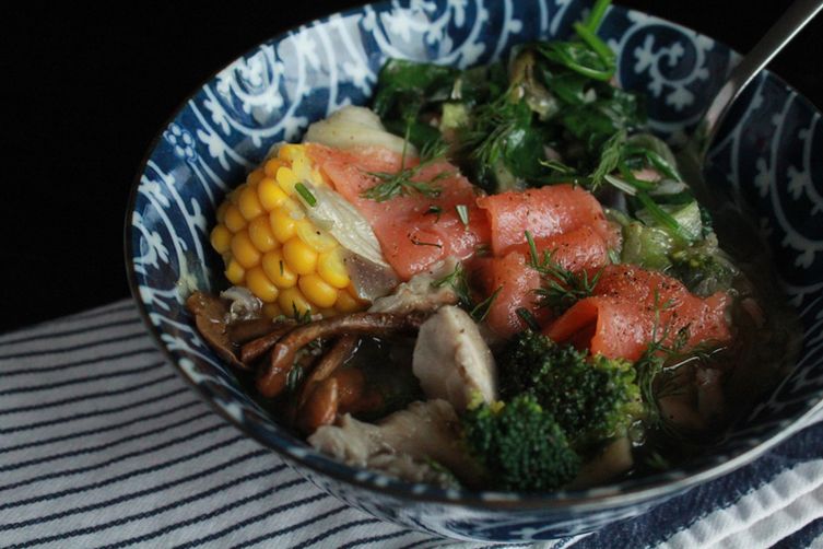 Salmon soup with mushrooms, broccoli, spinach and corn