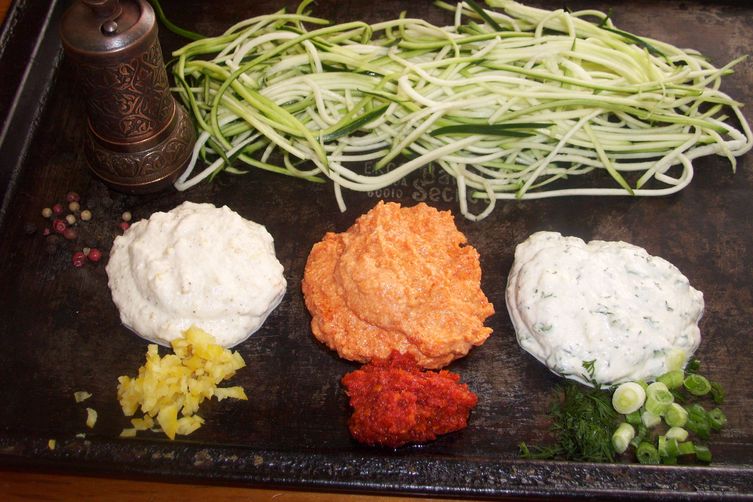 Raw zucchini noodles with three sauces