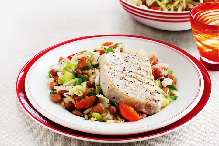 Pork steaks with warm cabbage and bean salad