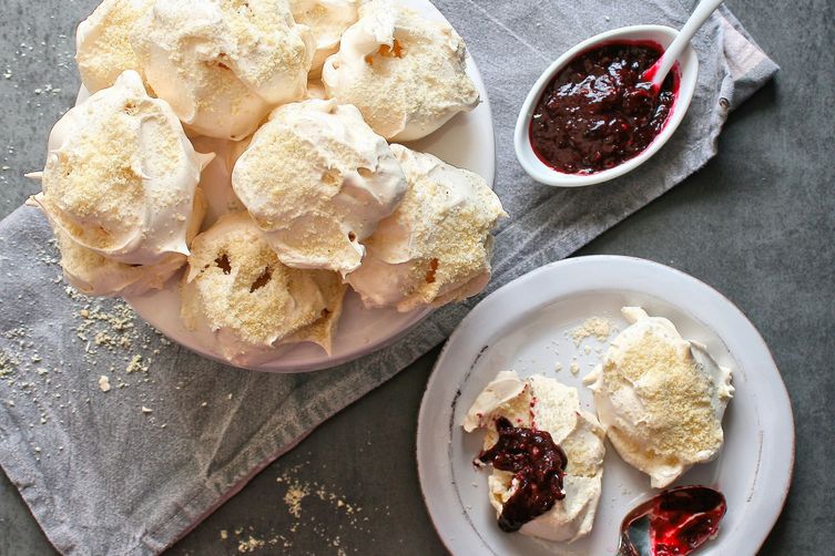 Vanilla bean and almond meringues with a mixed berry sauce.