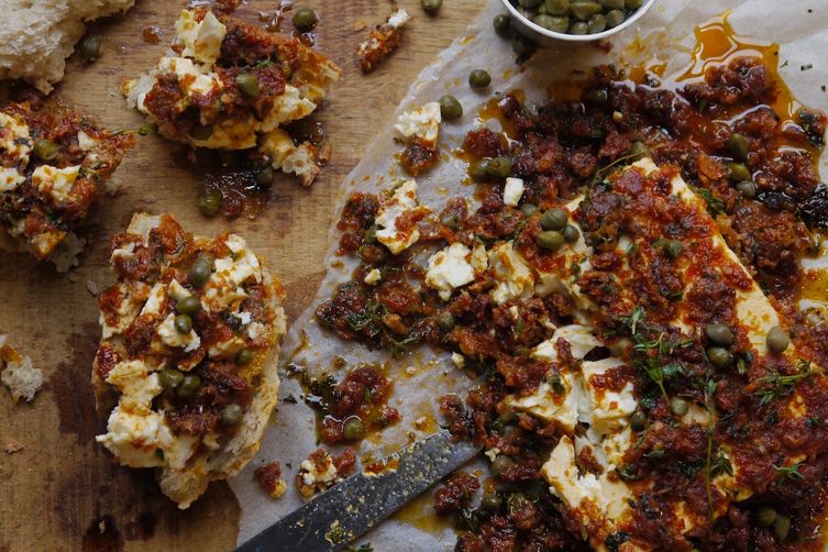 Baked feta cheese with sun dried tomato and capers